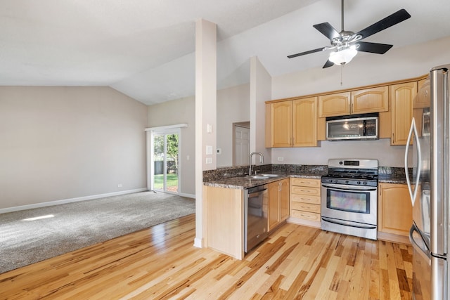 400 Bayview Ave, Naperville, IL 60565 - kitchen featuring appliances with stainless steel finishes, light brown cabinetry, vaulted ceiling, light wood-style flooring, and a sink