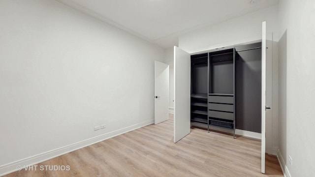 642 W Webster Ave Unit 1, Chicago, IL 60614 - unfurnished bedroom with light wood-style flooring and baseboards