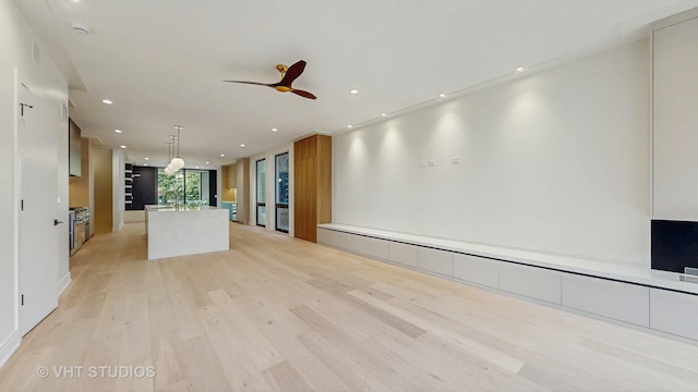 642 W Webster Ave Unit 1, Chicago, IL 60614 - unfurnished living room featuring light wood-style flooring, ceiling fan, a baseboard radiator, and recessed lighting