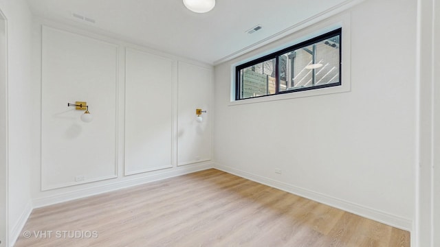 642 W Webster Ave Unit 1, Chicago, IL 60614 - unfurnished bedroom with wood finished floors and a decorative wall