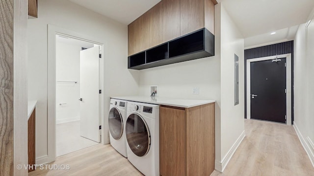642 W Webster Ave Unit 1, Chicago, IL 60614 - laundry area featuring cabinet space, light wood-type flooring, and washer and clothes dryer