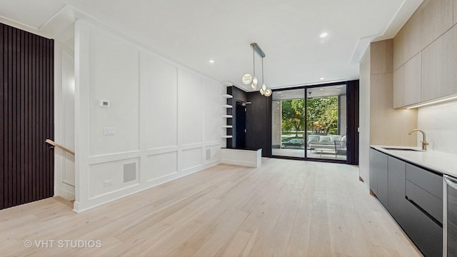 642 W Webster Ave Unit 1, Chicago, IL 60614 - unfurnished dining area featuring a decorative wall and light wood-style floors