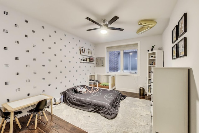 2312 W Belmont Ave Unit 1W, Chicago, IL 60618 - bedroom with wood finished floors, a ceiling fan, and baseboards