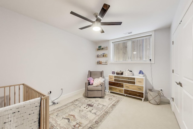 2312 W Belmont Ave Unit 1W, Chicago, IL 60618 - bedroom with a crib, carpet, a ceiling fan, and baseboards