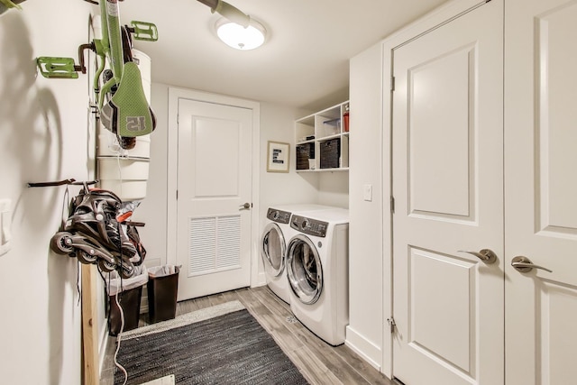 2312 W Belmont Ave Unit 1W, Chicago, IL 60618 - washroom with independent washer and dryer and light wood-style floors