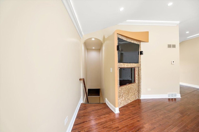 703 Berkshire Ln, Schaumburg, IL 60193 - hallway with wood finished floors, an upstairs landing, baseboards, arched walkways, and vaulted ceiling