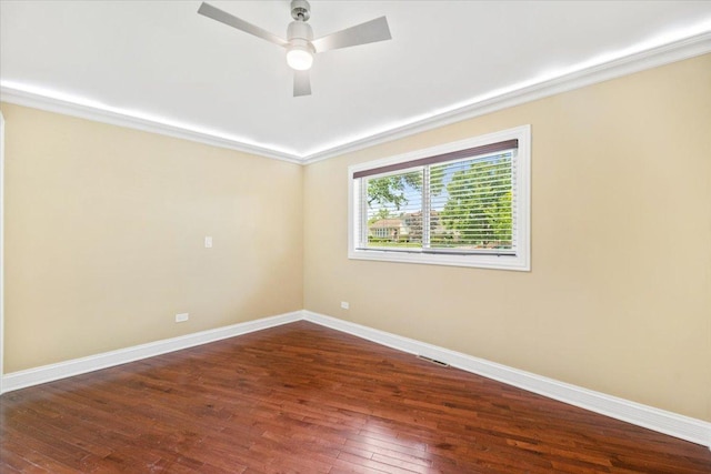 703 Berkshire Ln, Schaumburg, IL 60193 - spare room featuring baseboards, hardwood / wood-style floors, ceiling fan, and ornamental molding