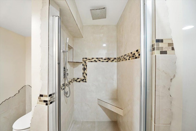 703 Berkshire Ln, Schaumburg, IL 60193 - bathroom with a stall shower and tile walls