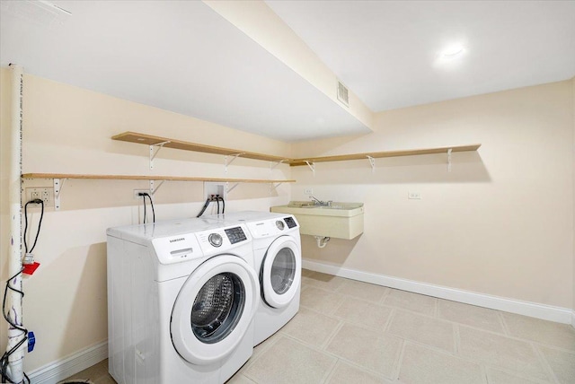 703 Berkshire Ln, Schaumburg, IL 60193 - laundry area with baseboards and washer and clothes dryer