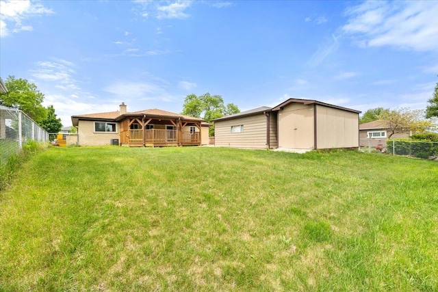 703 Berkshire Ln, Schaumburg, IL 60193 - back of house with a wooden deck and a chimney