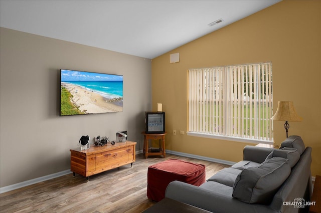 1840 Venson Ln Unit 1840, Joliet, IL 60435 - living area with lofted ceiling, wood finished floors, and baseboards