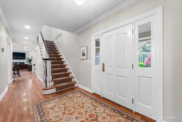 3 Woodley Mnr, Winnetka, IL 60093 - foyer with ornamental molding, stairway, wood finished floors, baseboards, and recessed lighting