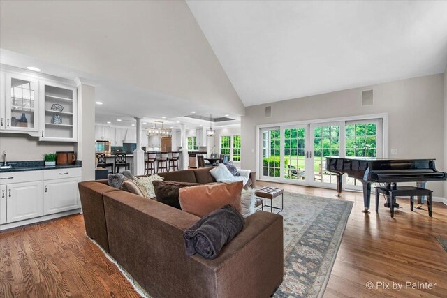 3 Woodley Mnr, Winnetka, IL 60093 - living area featuring wood finished floors, high vaulted ceiling, recessed lighting, french doors, and bar area