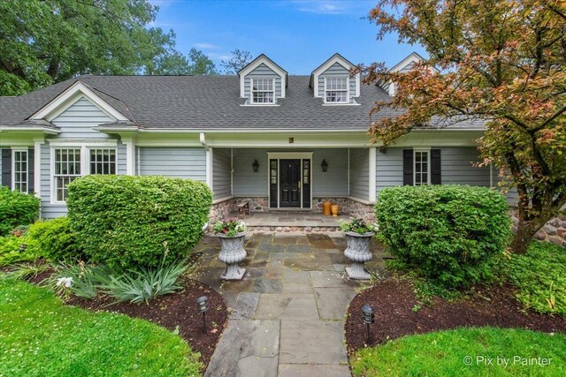 3 Woodley Mnr, Winnetka, IL 60093 - cape cod home with a shingled roof and stone siding