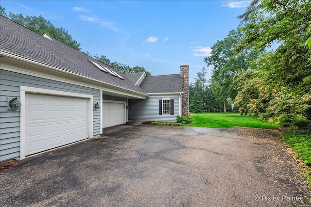 3 Woodley Mnr, Winnetka, IL 60093 - view of home's exterior featuring asphalt driveway, a chimney, an attached garage, a shingled roof, and a yard