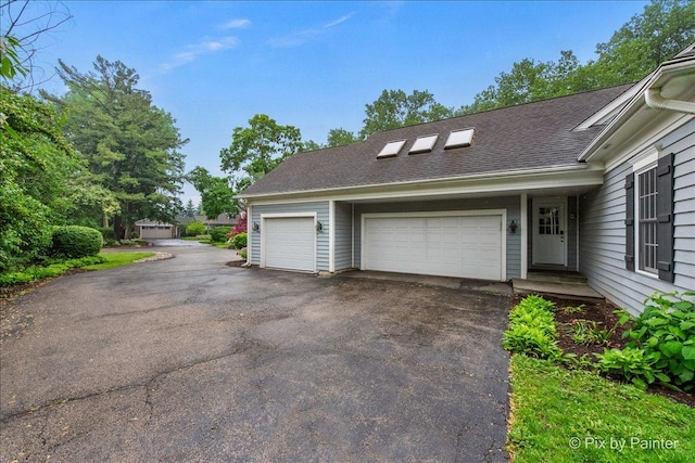 3 Woodley Mnr, Winnetka, IL 60093 - garage featuring driveway