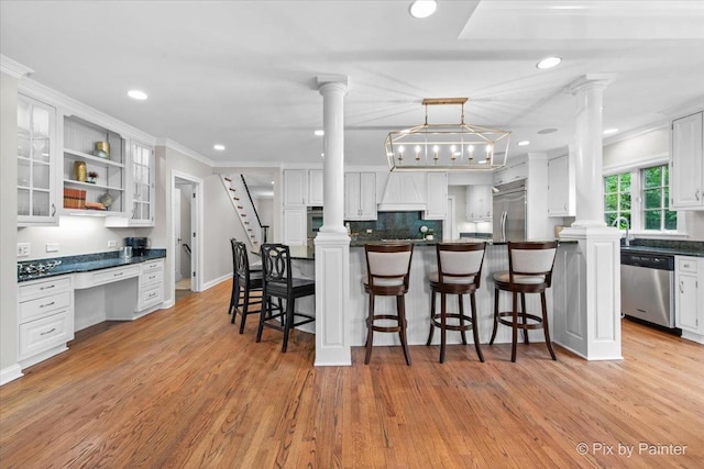 3 Woodley Mnr, Winnetka, IL 60093 - kitchen with stainless steel appliances, decorative columns, white cabinetry, recessed lighting, and ornamental molding