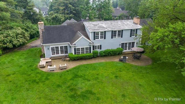 3 Woodley Mnr, Winnetka, IL 60093 - rear view of house with french doors, a chimney, a patio area, and a yard