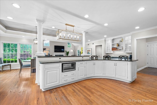 3 Woodley Mnr, Winnetka, IL 60093 - kitchen featuring ornate columns, dark countertops, ornamental molding, recessed lighting, and white cabinets