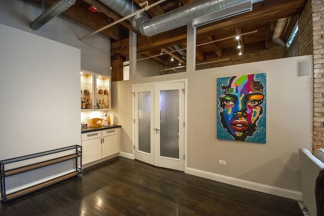 1727 S Indiana Ave Unit 214, Chicago, IL 60616 - basement featuring french doors, dark wood-style floors, and baseboards