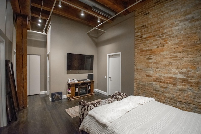 1727 S Indiana Ave Unit 214, Chicago, IL 60616 - bedroom featuring a high ceiling, wood finished floors, track lighting, and beamed ceiling