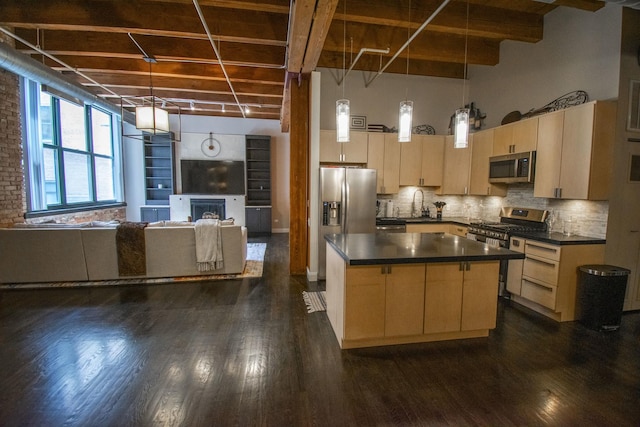 1727 S Indiana Ave Unit 214, Chicago, IL 60616 - kitchen with stainless steel appliances, dark countertops, light brown cabinets, a towering ceiling, and dark wood finished floors