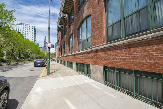 1727 S Indiana Ave Unit 214, Chicago, IL 60616 - view of street featuring a city view, sidewalks, curbs, and street lighting