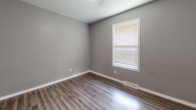 120 Harvest Glenn Dr, Davis Junction, IL 61020 - unfurnished room with dark wood finished floors and a ceiling fan