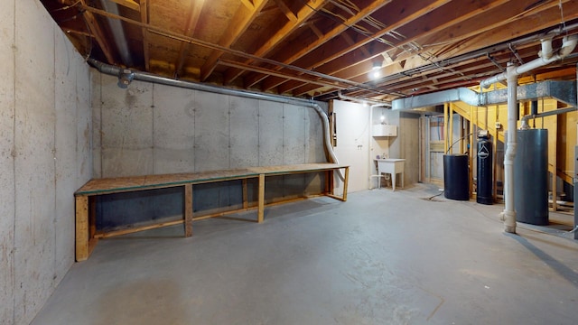 120 Harvest Glenn Dr, Davis Junction, IL 61020 - unfinished below grade area with water heater and a water softener system
