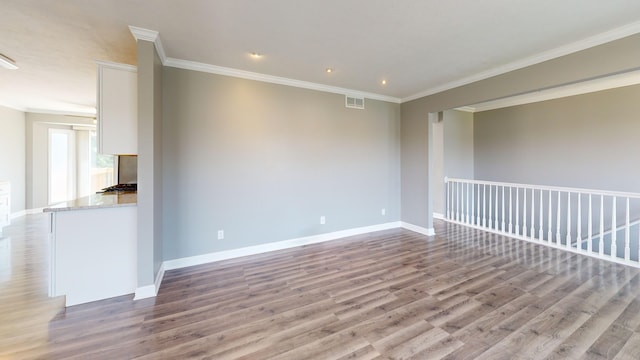 120 Harvest Glenn Dr, Davis Junction, IL 61020 - empty room with wood finished floors, crown molding, and recessed lighting