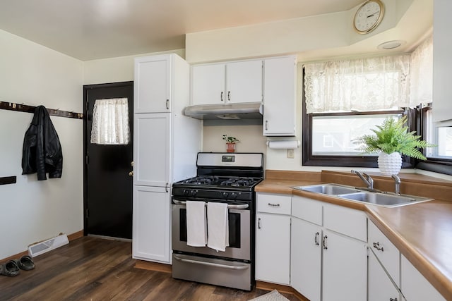 1410 Barnhart Ct, Zion, IL 60099 - kitchen featuring gas stove, a sink, under cabinet range hood, and white cabinetry