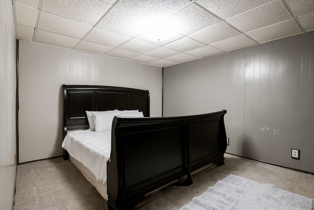 1410 Barnhart Ct, Zion, IL 60099 - bedroom featuring carpet flooring, a paneled ceiling, baseboards, and a decorative wall