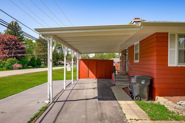 1410 Barnhart Ct, Zion, IL 60099 - view of patio featuring asphalt driveway