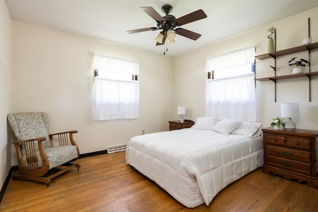 1410 Barnhart Ct, Zion, IL 60099 - bedroom with hardwood / wood-style flooring, baseboards, and ceiling fan