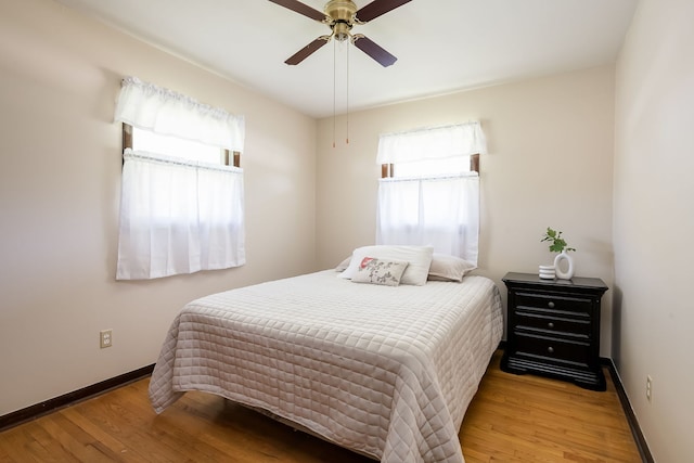 1410 Barnhart Ct, Zion, IL 60099 - bedroom featuring wood finished floors, baseboards, and a ceiling fan