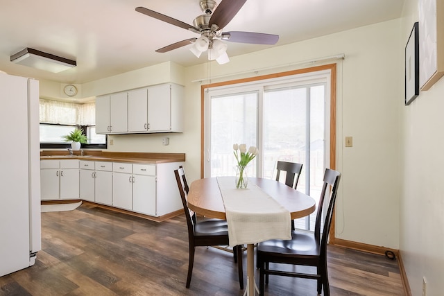 1410 Barnhart Ct, Zion, IL 60099 - dining space with dark wood-style floors, baseboards, and ceiling fan