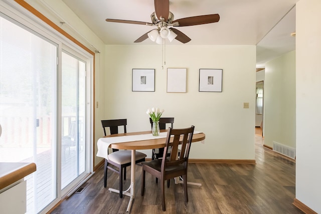 1410 Barnhart Ct, Zion, IL 60099 - dining room featuring dark wood-type flooring, plenty of natural light, a ceiling fan, and baseboards