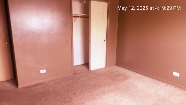 3145 Bernice Rd Unit 4, Lansing, IL 60438 - unfurnished bedroom featuring carpet, a closet, and baseboards