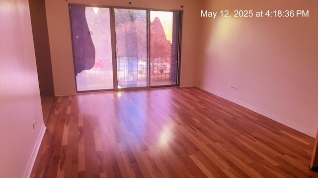 3145 Bernice Rd Unit 4, Lansing, IL 60438 - unfurnished room featuring wood finished floors and baseboards