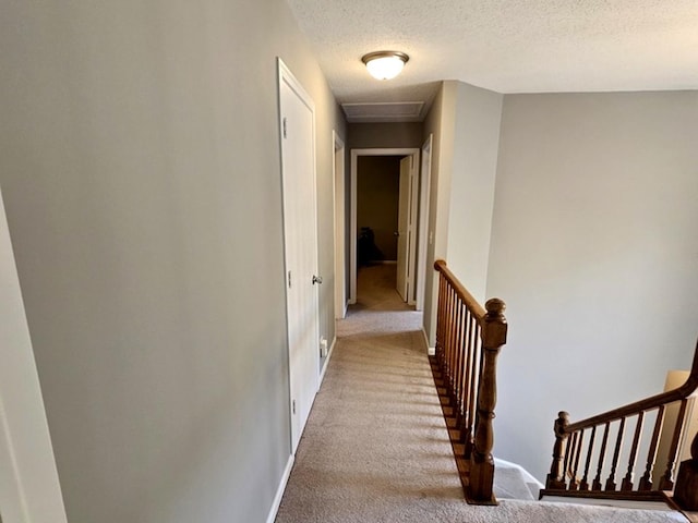 1602 Nightengale Cir, Lindenhurst, IL 60046 - hallway featuring carpet flooring, an upstairs landing, a textured ceiling, and baseboards