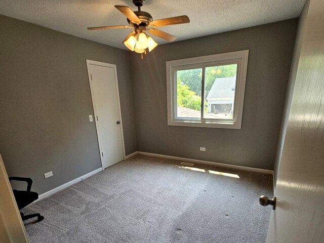1602 Nightengale Cir, Lindenhurst, IL 60046 - unfurnished room featuring carpet flooring, a ceiling fan, baseboards, and a textured ceiling
