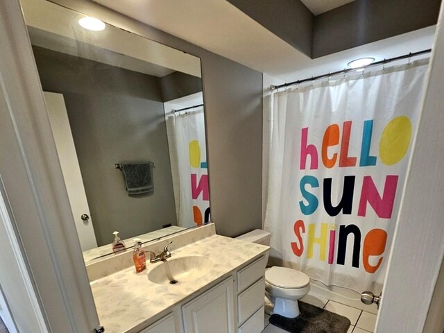 1602 Nightengale Cir, Lindenhurst, IL 60046 - full bathroom with vanity, toilet, tile patterned floors, and a shower with shower curtain