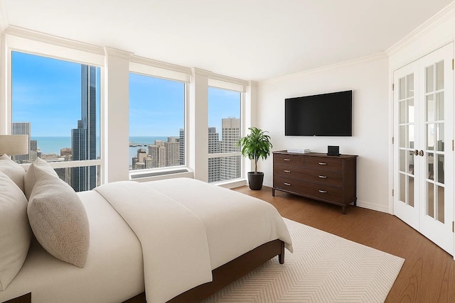 111 E Chestnut St Unit 39C, Chicago, IL 60611 - bedroom with wood finished floors, ornamental molding, and baseboards