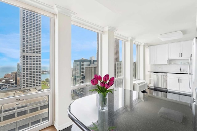 111 E Chestnut St Unit 39C, Chicago, IL 60611 - dining area featuring crown molding, a view of city, and a water view