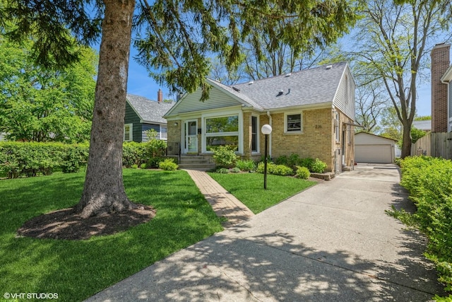 view of front of home with brick siding, a detached garage, an outdoor structure, and roof with shingles