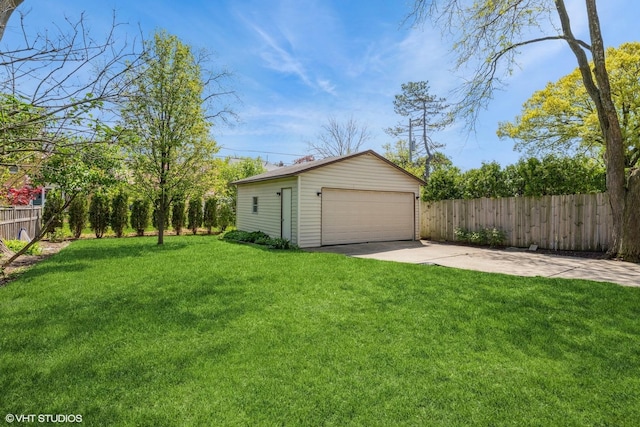 view of yard with an outbuilding and a detached garage