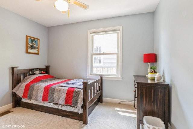 carpeted bedroom featuring baseboards