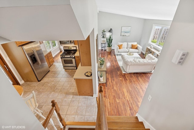 269 Cascade Dr, Crystal Lake, IL 60012 - living area with stairs, light wood-type flooring, and baseboards