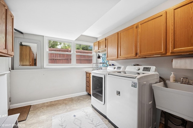 269 Cascade Dr, Crystal Lake, IL 60012 - laundry area featuring cabinet space, washer and dryer, and baseboards