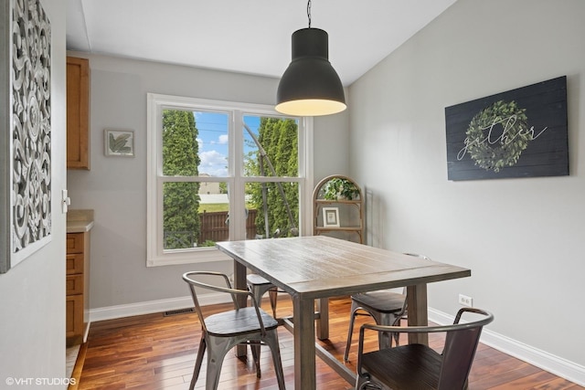 269 Cascade Dr, Crystal Lake, IL 60012 - dining space with dark wood-type flooring and baseboards